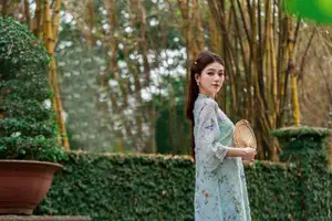 Graceful Ao Dai Girl Amidst Bamboo: Timeless Beauty and Serenity - image 7
