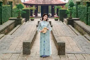 Graceful Ao Dai Girl Amidst Bamboo: Timeless Beauty and Serenity - image 5