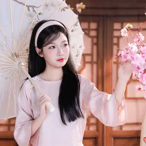 Graceful Asian Girl with Spring Blossoms Timeless Beauty Unveiled - image 0