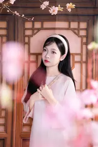 Graceful Asian Girl with Spring Blossoms Timeless Beauty Unveiled - image 3