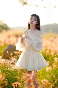 Golden Hour Dream: Ethereal Beauty in White Amidst a Blooming Field - image 1
