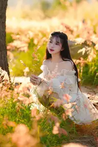 Golden Hour Dream: Ethereal Beauty in White Amidst a Blooming Field - image 0