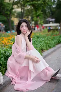 VGU No171: Vietnamese Beauty Graces a Flower Garden in Elegant Pink Ao Dai and Conical Hat - image 0