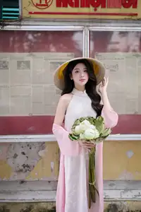 VGU No171: Vietnamese Beauty Graces a Flower Garden in Elegant Pink Ao Dai and Conical Hat - image 4