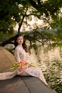 Vietnamese Ao Dai Beauty by the Lake at Sunset: Graceful Girl with Vibrant Gladiolus Flowers. - image 5