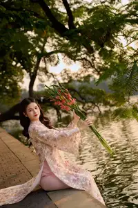 Vietnamese Ao Dai Beauty by the Lake at Sunset: Graceful Girl with Vibrant Gladiolus Flowers. - image 1
