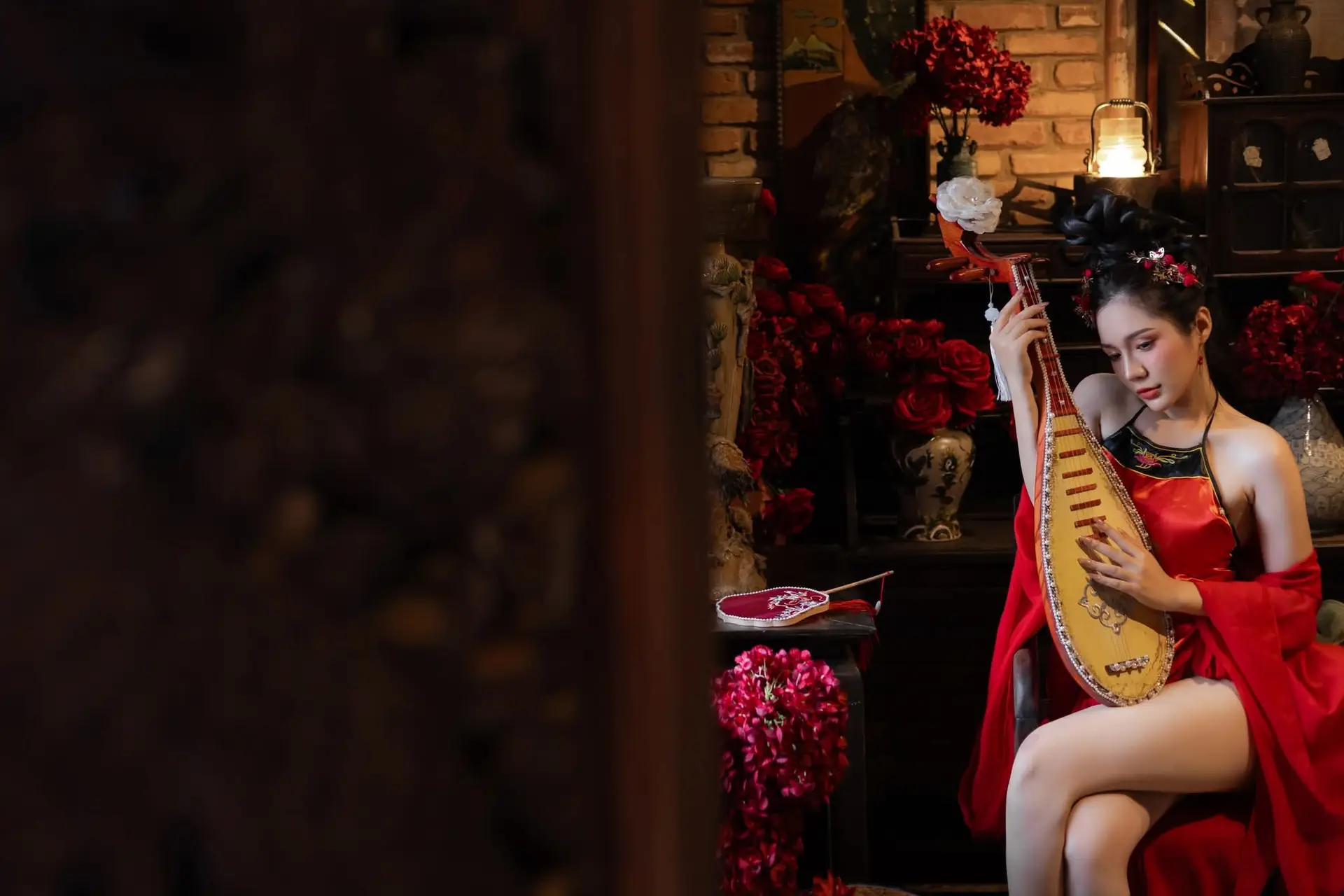 Alluring Asian Beauty with Pipa: Elegant in Traditional Red Attire