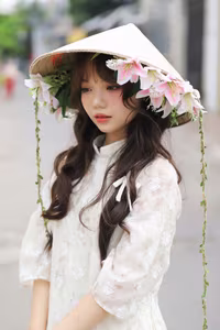 VGU No.143: Discover the Ethereal Beauty of a Vietnamese Girl in Ao Dai and Floral Conical Hat - image 1