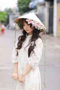 VGU No.143: Discover the Ethereal Beauty of a Vietnamese Girl in Ao Dai and Floral Conical Hat - image 3