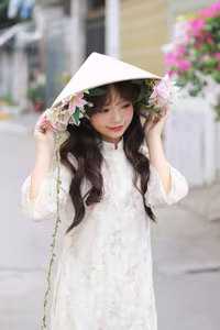 VGU No.143: Discover the Ethereal Beauty of a Vietnamese Girl in Ao Dai and Floral Conical Hat - image 2