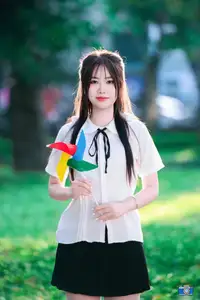 Radiant Youth: Vietnamese Girl's Bright Smile with Pinwheel in Golden Sunlight - image 5
