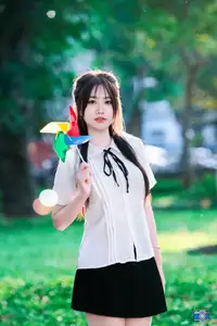 Radiant Youth: Vietnamese Girl's Bright Smile with Pinwheel in Golden Sunlight - image 9