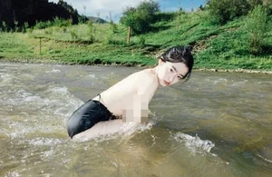 Stunning Outdoor Photography: Capturing Natural Beauty and Bold Fashion in Serene Stream Settings - image 4