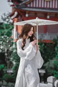 Explore Ethereal Asian Beauty: A Graceful Girl in White Ao Dai Amidst Ancient Oriental Charm - image 3