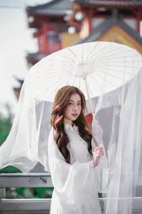 Explore Ethereal Asian Beauty: A Graceful Girl in White Ao Dai Amidst Ancient Oriental Charm - image 6