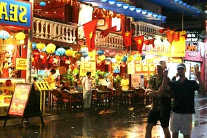 Exploring Ho Chi Minh City in the Rain: Locals and Tourists Embrace the Weekend Despite Stormy Weather - image 6