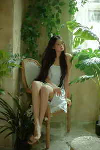 VGU No.190: Ethereal Beauty: Long-Haired Woman Amidst a Dreamy Indoor Garden Sanctuary - image 1