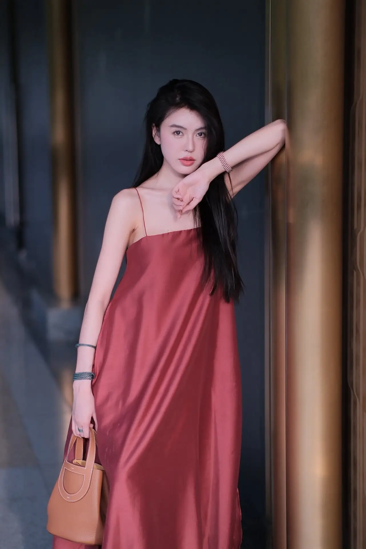 Stunning Maxi Dress Style: A Beautiful Woman's Elegant Pose.