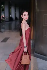 Stunning Maxi Dress Style: A Beautiful Woman's Elegant Pose. - image 7