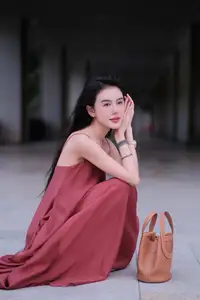 Stunning Maxi Dress Style: A Beautiful Woman's Elegant Pose. - image 1