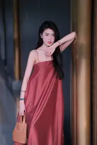 Stunning Maxi Dress Style: A Beautiful Woman's Elegant Pose. - image 0