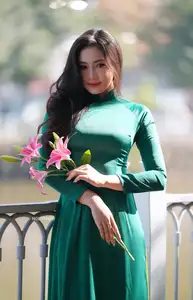Vietnamese Grace: Elegant Woman in Green Ao Dai with Pink Lotus Flower 1000025232 - image 16