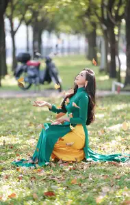 Vietnamese Grace: Elegant Woman in Green Ao Dai with Pink Lotus Flower 1000025232 - image 10