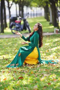 Vietnamese Grace: Elegant Woman in Green Ao Dai with Pink Lotus Flower 1000025232 - image 15