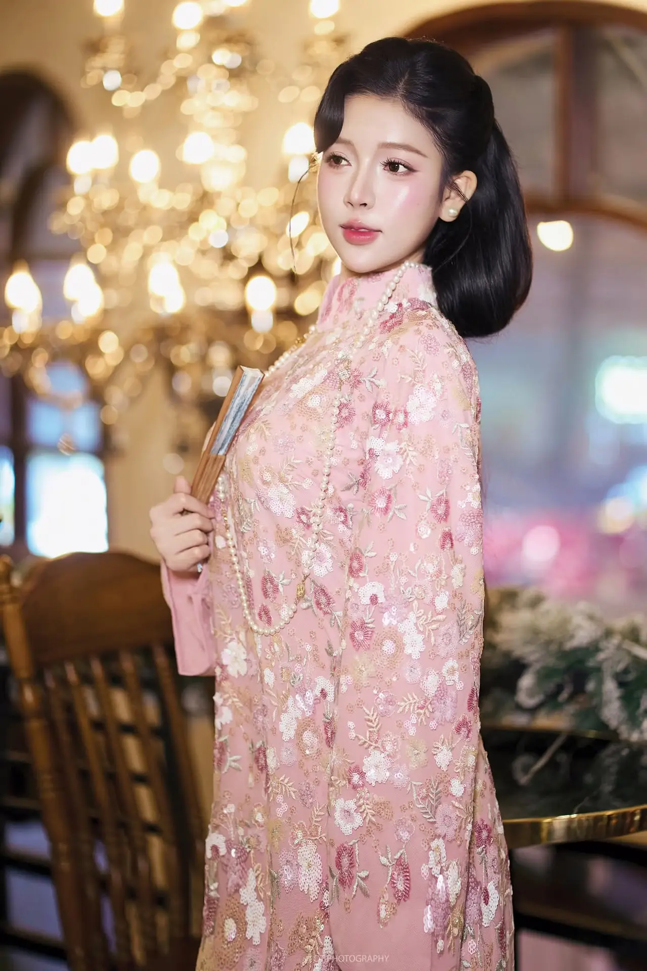 Graceful Pink Ao Dai Beauty: Elegant Vietnamese Woman with Alluring Pearl Jewelry