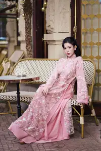 Graceful Pink Ao Dai Beauty: Elegant Vietnamese Woman with Alluring Pearl Jewelry - image 10