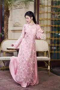 Graceful Pink Ao Dai Beauty: Elegant Vietnamese Woman with Alluring Pearl Jewelry - image 3