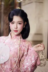 Graceful Pink Ao Dai Beauty: Elegant Vietnamese Woman with Alluring Pearl Jewelry - image 9