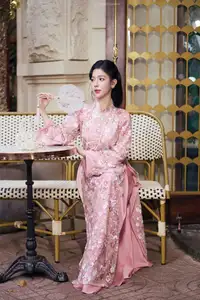 Graceful Pink Ao Dai Beauty: Elegant Vietnamese Woman with Alluring Pearl Jewelry - image 1