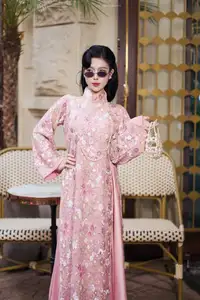 Graceful Pink Ao Dai Beauty: Elegant Vietnamese Woman with Alluring Pearl Jewelry - image 5