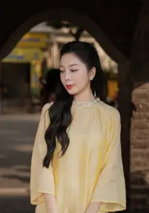 Graceful Vietnamese Beauty: Elegant Woman in Modern Traditional Attire Captures Asian Charm - image 2