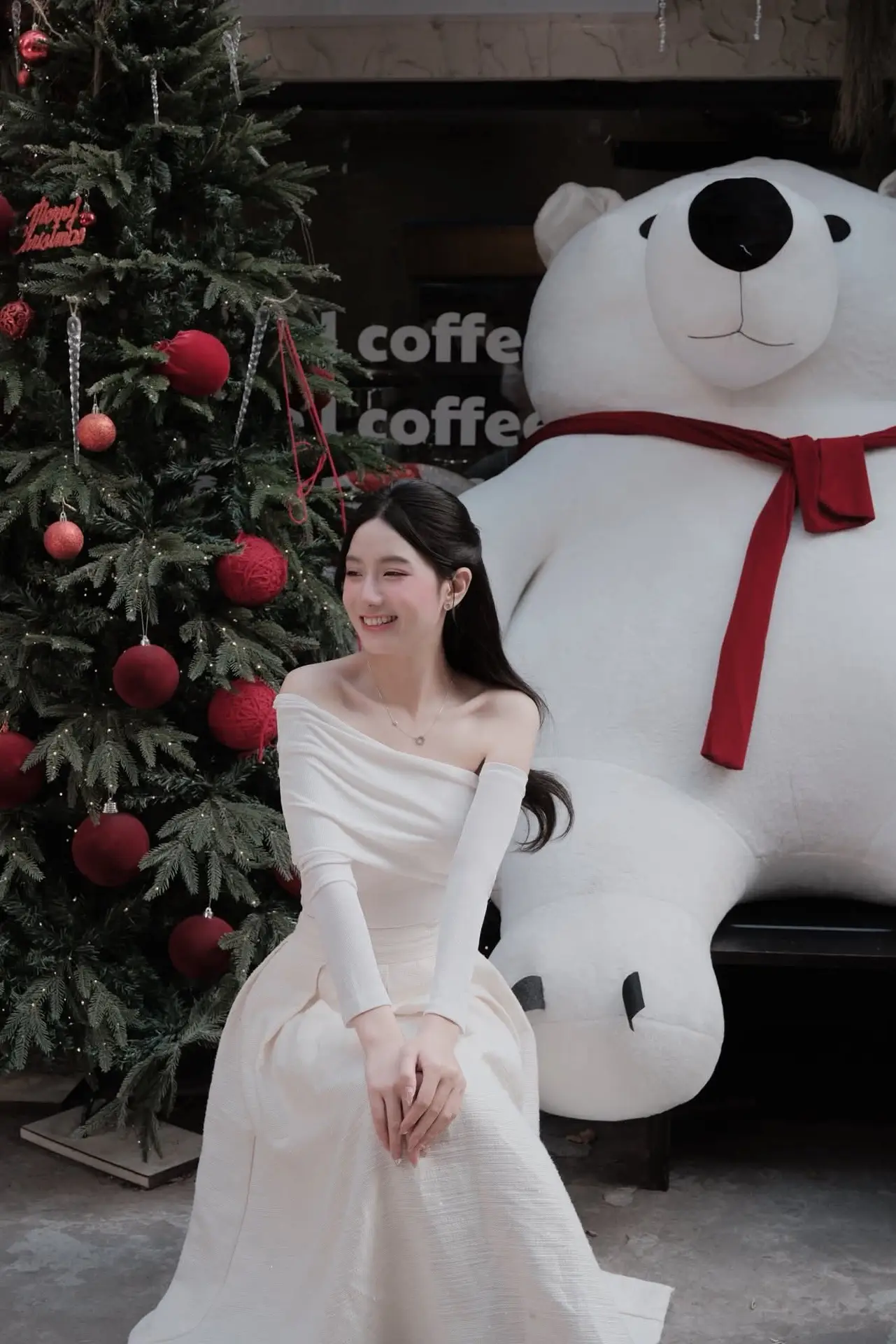 Christmas Radiance: Girl in Elegant White Dress and Joyful Smile