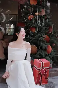 Christmas Radiance: Girl in Elegant White Dress and Joyful Smile - image 1