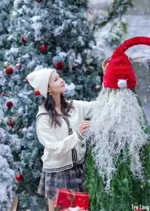 Charming Winter Girl Amidst Beautiful Christmas Snowfall - image 3