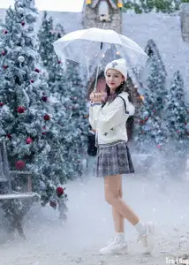 Charming Winter Girl Amidst Beautiful Christmas Snowfall - image 0