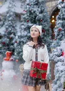 Charming Winter Girl Amidst Beautiful Christmas Snowfall - image 4