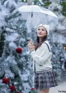 Charming Winter Girl Amidst Beautiful Christmas Snowfall - image 5