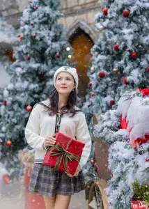 Charming Winter Girl Amidst Beautiful Christmas Snowfall - image 8