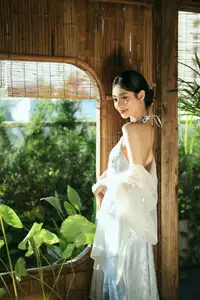 East Asian Grace: Girl in Modernized Attire and Exquisite Hair Ornament - image 3