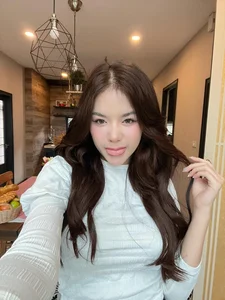 Stunning Thai Fashion Influencer in Elegant Sheer Mini Dress Collection - image 2