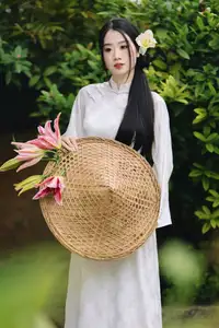 Discover the Grace of a Vietnamese Woman in White Ao Dai with Elegant Lilies - image 8