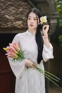 Discover the Grace of a Vietnamese Woman in White Ao Dai with Elegant Lilies - image 9