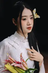 Discover the Grace of a Vietnamese Woman in White Ao Dai with Elegant Lilies - image 5