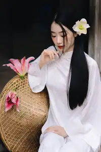 Discover the Grace of a Vietnamese Woman in White Ao Dai with Elegant Lilies - image 10