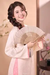 Radiant Smile of a Vietnamese Girl in Modern Ao Dai and Elegant Fan - image 0