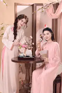 Radiant Smile of a Vietnamese Girl in Modern Ao Dai and Elegant Fan - image 4